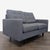 This stylish dark gray loveseat features soft fabric upholstery and comfortable, tufted cushions. Its compact size and...