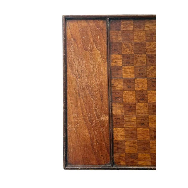 Antique 19th century wooden folk art primitive game board (checkers/chess) with hand stamped numbers. The board features a...