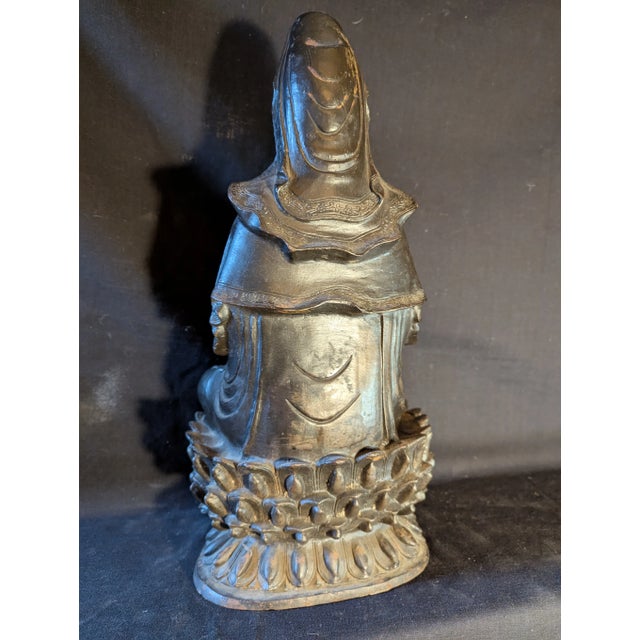Charming cast iron statue of the Bodhisattva of Compassion, mid 20th-century manufacture. Weight: 22 pounds.