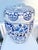 Hand-painted with vibrant floral and butterfly motifs, this glazed stool doubles as a charming side table. Its rich blue...
