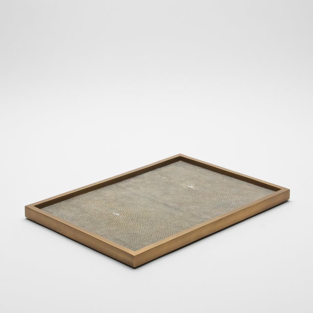 The Rectangular Tray in Grey Shagreen with Bronze Patina Brass by Kifu Paris is an epitome of understated elegance,...