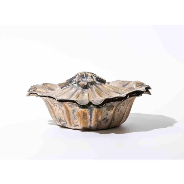 Elegant circular silver-plated vanity or trinket box of restrained classical design, featuring a fitted lid with delicate...