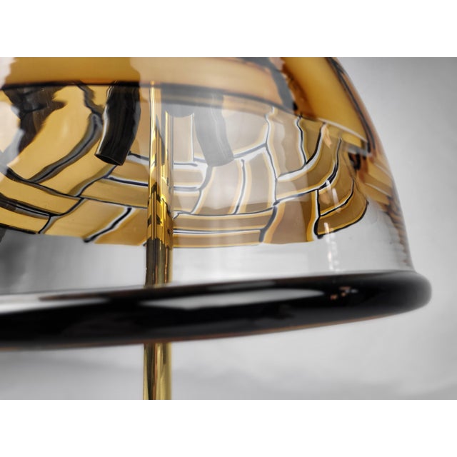 Large Italian table lamp from the 70s by Barovier&Toso. Solid brass base structure and large bell shade in transparent...
