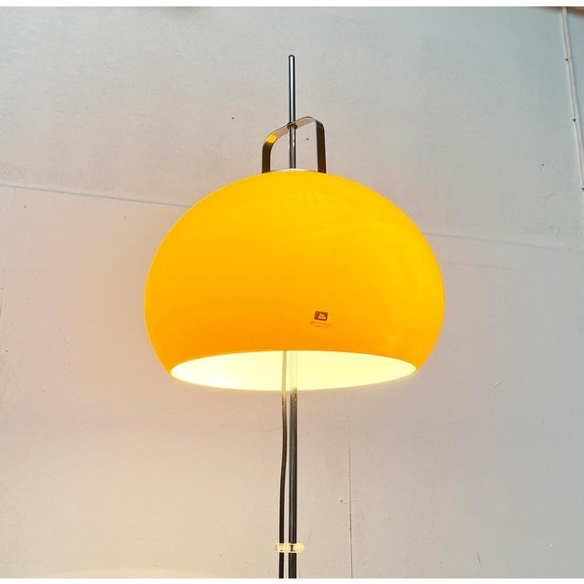 Classic space age sticking lamp from guzzini. Here in a rare version with a yellow umbrella. a classic design from the...