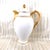 This is a Deliniers and Cie Limoges chocolate pot or coffee pot in an unkinown pattern. The pot is shiny white with gold...