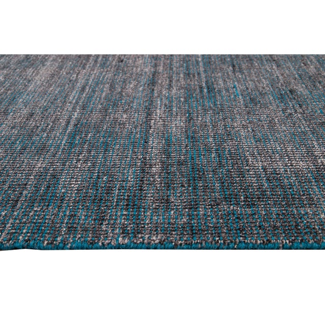 Beautiful modern Handmade Indian bamboo and silk boho rug with a gray and teal field. This Boho Collection Rug has an all-...