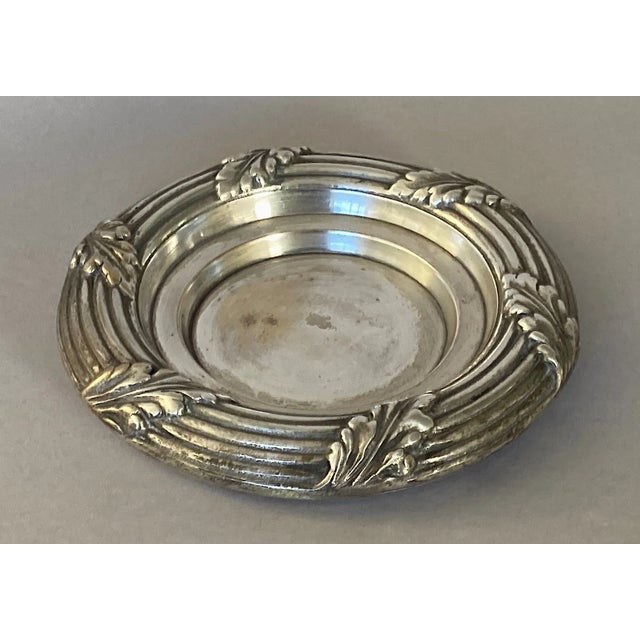 This wondrous object serves as a wine bottle holder on the table. In the French manner, it’s massively overbuilt, and...