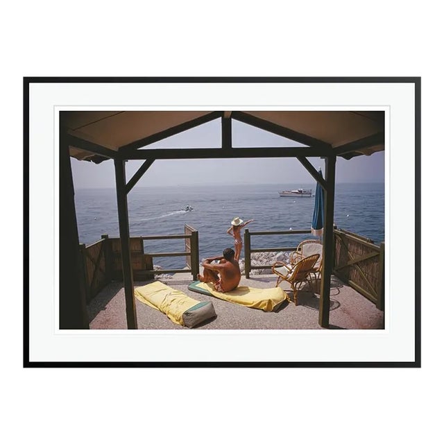 Beach Hut in Antibes 1969 by Slim Aarons Black Framed C Print For Sale