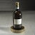 A sleek and striking addition to any wine presentation, this round stainless steel wine bottle coaster features a matte...