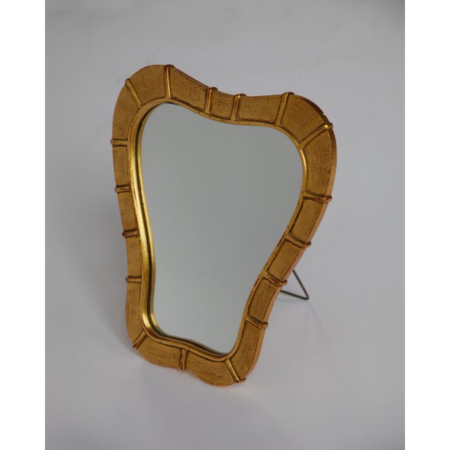 Italian Gilt Wood Table Mirror, 1950s Mid-century Italian table mirror in gilt wood. Can hang on a wall or stand on a...