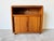 This vintage mid-century modern tambour door serving cart or TV stand blends functionality with timeless design. Crafted...