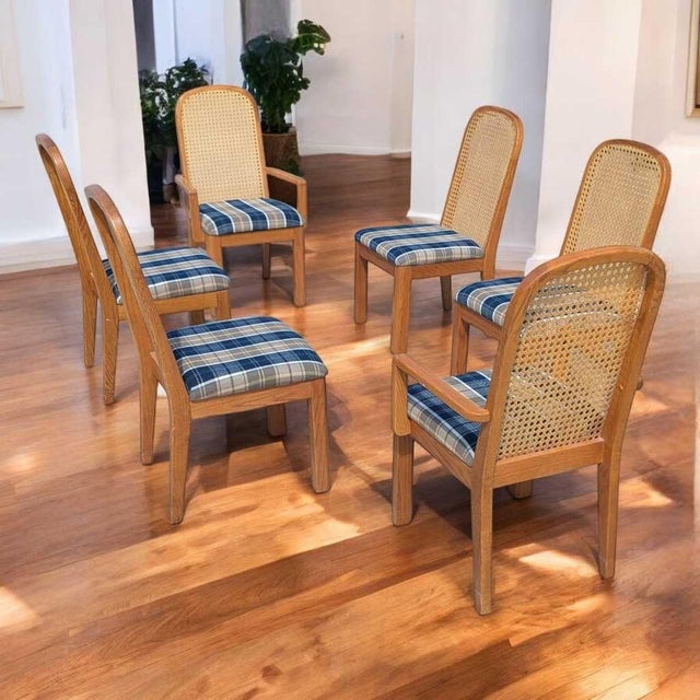 Set of six postmodern cane back dining chairs by Douglas Furniture, circa 1980s, with new plaid upholstery. The set...