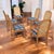 Set of six postmodern cane back dining chairs by Douglas Furniture, circa 1980s, with new plaid upholstery. The set...