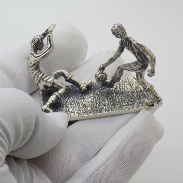 Suspended in high tension and sporting drama, this vintage silver narrative scene captures the exact moment of a penalty...
