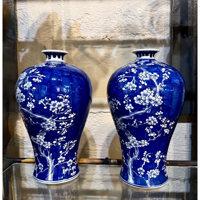 This is a very good example of a late Chinese Export cobalt blue Meiping vase decorated with branches of flowering white...