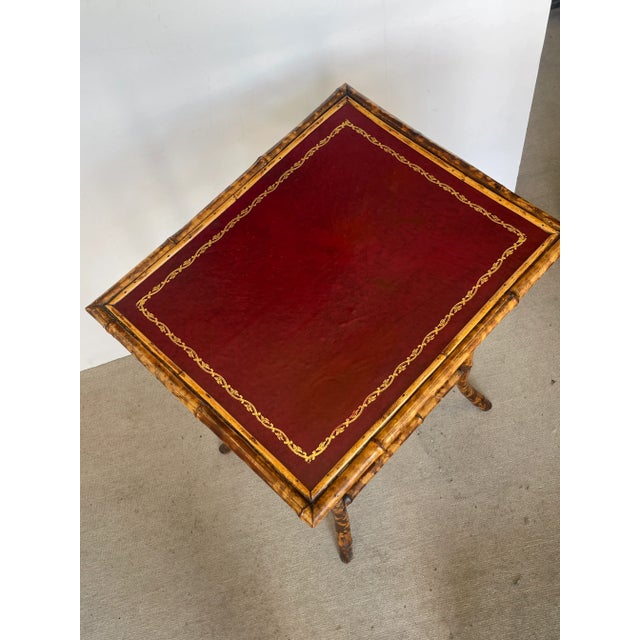 Just in, this great looking French 19Th. C. Tortoiseshell Bamboo two tier Table with Red Tooled Leather Top. The...