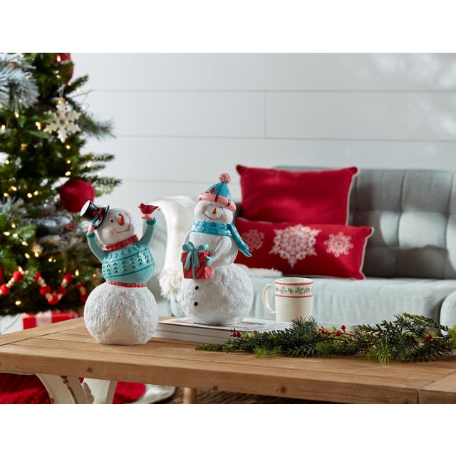 Add a touch of festive charm to your home this holiday season with this set of Whimsical Snowman Figurines. Crafted from...