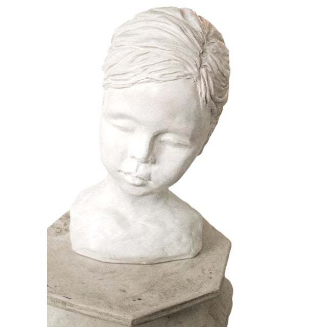 Sculptural bust of a young girl with a pony tale. Artist signed Kathi Colman, California 2002 WE COMBINED SHIPPING If you...
