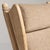 A brown wood, Mid-Century Modern-style armchair, dating to the 1970s and made in France. The wood frame is finished in...