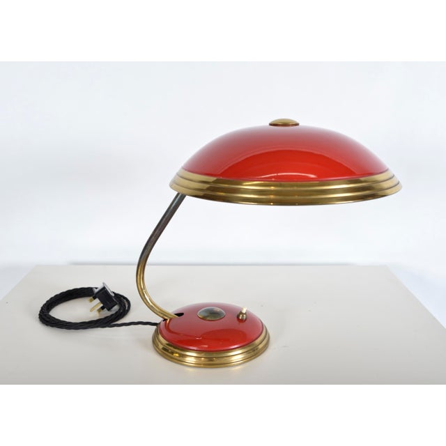 This is a great example of the much sought after 1950s modernist german helo leuchten lamp. The lamp has a curved brass...