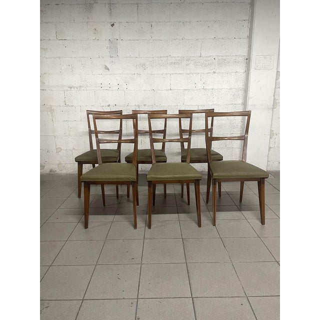 Set of 6 1960s chairs with walnut structure and seat covered in green sky, classic color of that period. The backrest is...