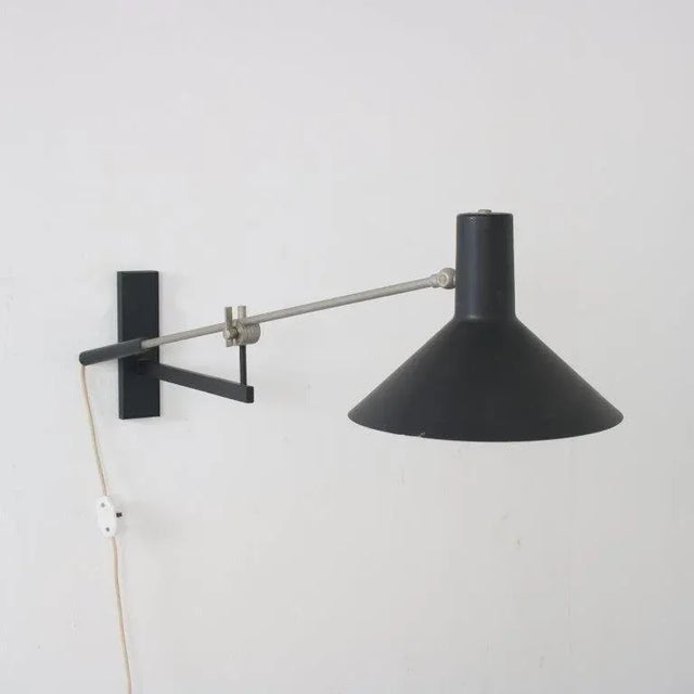 A beautiful modern wall lamp, model “7105”, designed by j. J. M. Hoogervorst and manufactured by anvia in the netherlands...