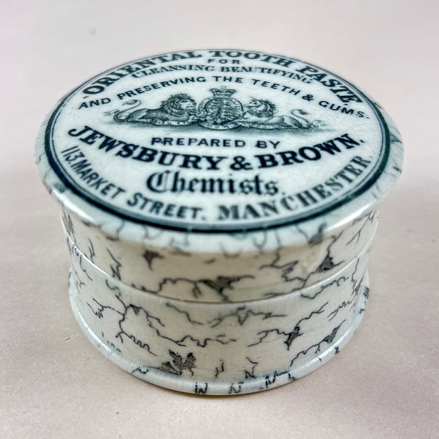 An Oriental Toothpaste pot, Staffordshire, England, circa 1880. Transfer printed in black on a creamy white earthenware,...