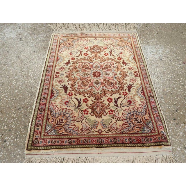 This exquisite Mid-20th century Turkish Herekeh silk rug, showcases the refined artistry and technical mastery for which...