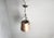 Vintage brutalist hammered copper sheet pendant light. The lamp emits a nice diffuse light thanks to the perforated shade....