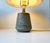 This stoneware table lamp was designed by Gunnar Nylund and produced by Rörstrand. It was made of hand-thrown stoneware in...