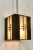Stylish Currey & Co. Asian Modern Kiyamacki Lantern from the Koshi Collection, carved wood with frosted glass panels, one...