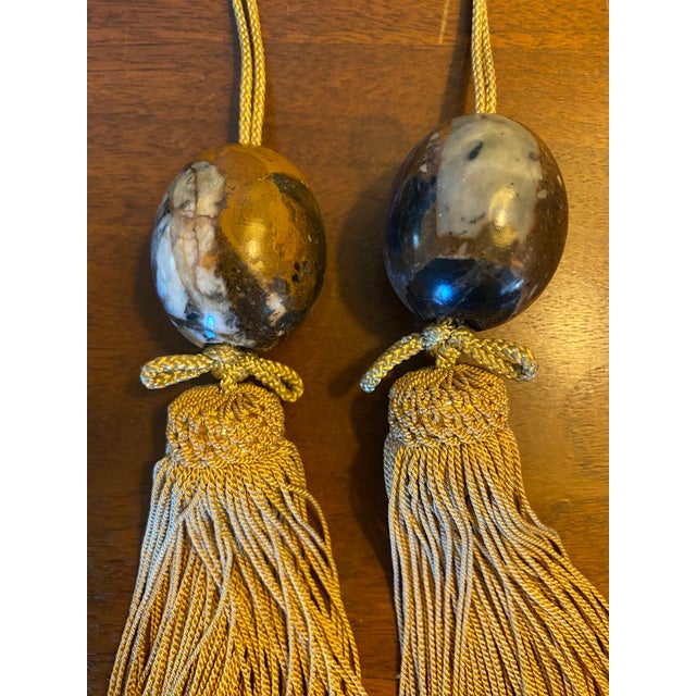 Pair of gorgeous vintage Japanese marble scroll weights with silk tassels known as fuchin, that hang on the bottom of...