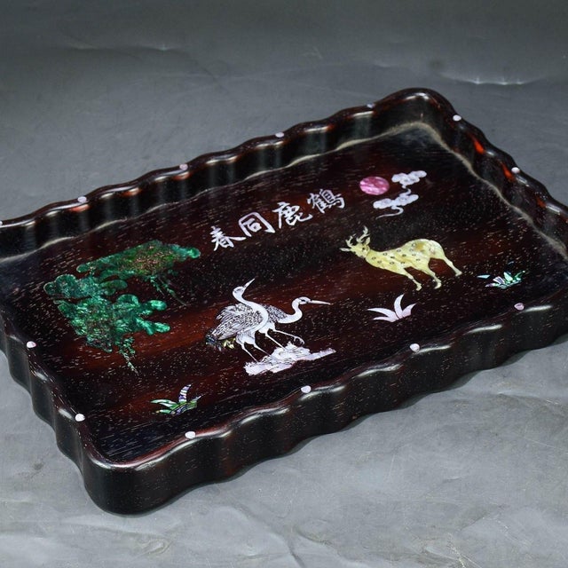 This is a beautifully crafted rectangular wooden tray featuring intricate mother-of-pearl (nacre) inlay work and a...