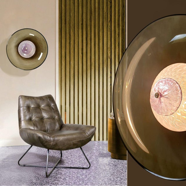 Pair of large Mid Century Modern Murano glass sconces, Italy circa 1990s. The modern sconces are made of a round and...