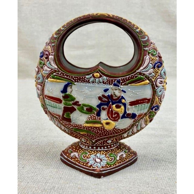 An exquisite early 20th-century Japanese Satsuma-style porcelain basket vase featuring exceptionally rich, high-relief...