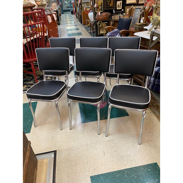 Authentic 1950’s dining table and chairs. Rare color with 2 leaves and 6 chairs. The chairs have brand new professional...