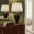 Bring dramatic elegance to your space with this vintage Hollywood Regency ceramic amphora‑urn table lamp, finished in a...