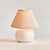 This sweet little offwhite ceramic lamp is at home in any coastal setting. The texturedCream shade and petite base make it...