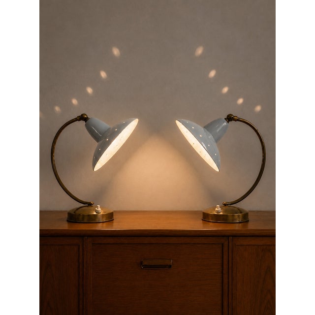 An incredible pair of original 1950s table lamps, the ultimate expression of Italian Mid-Century Modern design. This set...