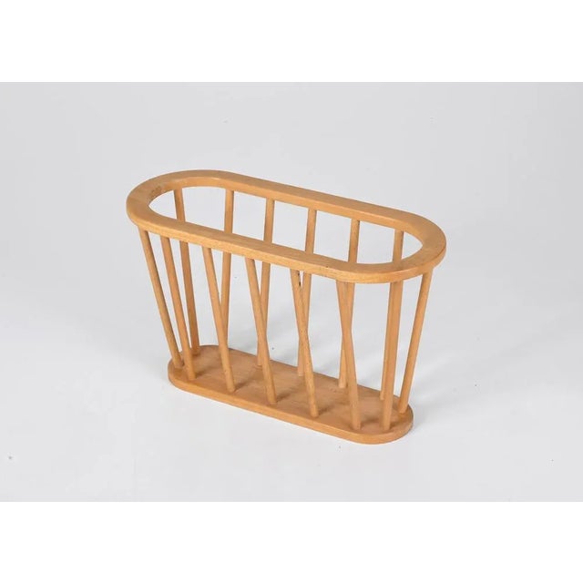 Amazing Mid-Century Modern oak wood magazine rack. This fantastic item was produced in Denmark during the 1970s. A...