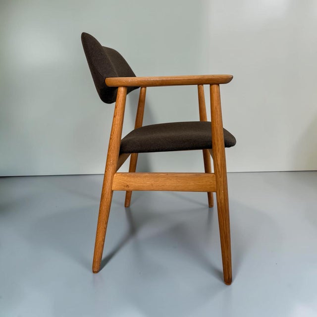 Elegant GM11 armchair designed by Svend Aage Eriksen for Glostrup Møbelfabrik, Denmark, in the 1960s. The chair features a...