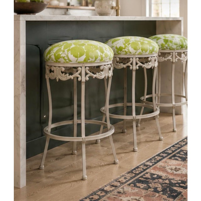 Bring a vibrant, organic elegance to your kitchen island with this stunning set of three reupholstered counter stools....