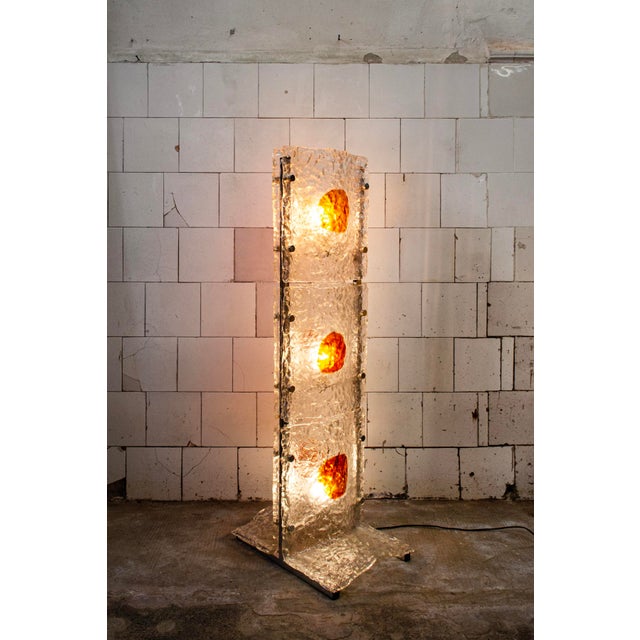 Three-light floor lamp with a chromed metal frame and corrugated Murano glass plates. Designer: Mauro Marzollo...