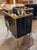 Sleek pair of black Murano glass and brass cabinets. The cabinets are custom-made and exude a luxurious and stylish look,...