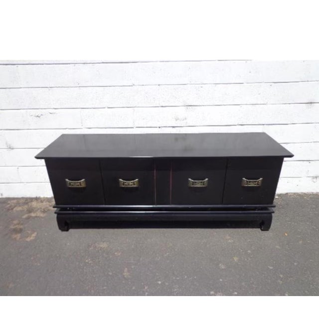 Gorgeous vintage Asian style low cabinet / console credenza. Well constructed with beautiful decorative hardware. This...