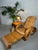 Paul Frankl-style chaise longue (pretzel chair). Gracefully shaped bamboo frame with wicker seat and backrest. Three-level...