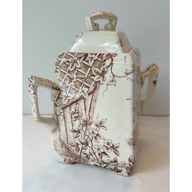 Large JH Davis Victor transferware sugar bowl with side handles and lid. The 19th century piece includes a windmill and...