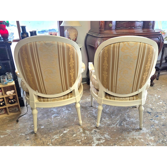 Pair of accent / side Chairs. They have been professionally reupholstered with a beautiful Hollywood Regency style fabric....