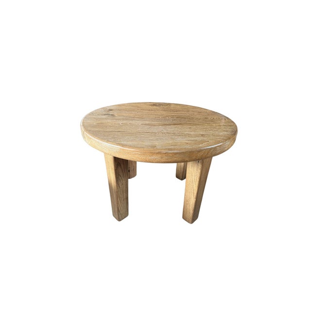 This striking solid teak wood dining table is a celebration of material honesty and sculptural form. Crafted from richly...