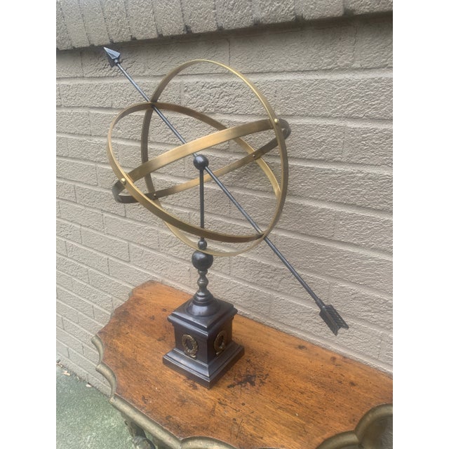 A beautifully crafted iron and brass armillary sphere, evoking the timeless elegance of classical European gardens. Pieces...